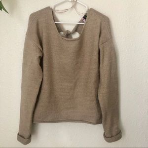 Beige sweater with ties in the back